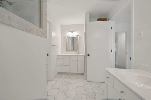 2006 Country Oaks Dr, Garland, TX 75040 - bathroom featuring two vanities and tile patterned floors