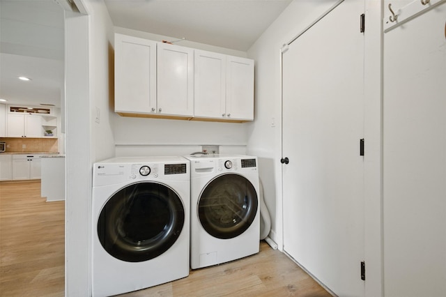 2006 Country Oaks Dr, Garland, TX 75040 - washroom featuring cabinet space, separate washer and dryer, light wood finished floors, and recessed lighting