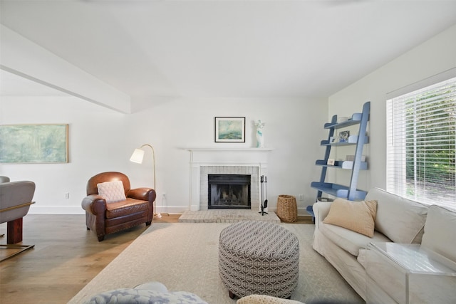 2006 Country Oaks Dr, Garland, TX 75040 - living area featuring wood finished floors and a brick fireplace