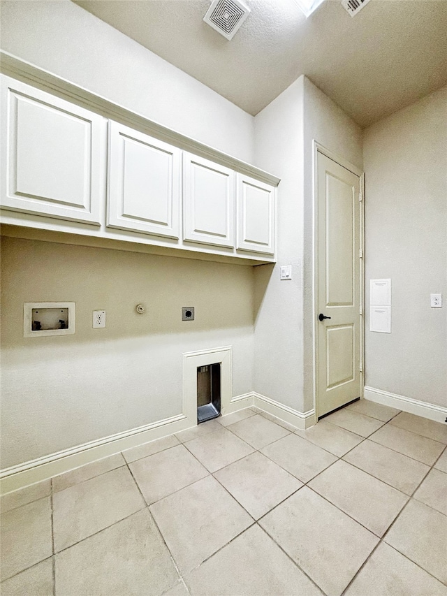 3037 Crestwater Rdg, Keller, TX 76248 - laundry room with cabinet space, hookup for an electric dryer, light tile patterned floors, washer hookup, and hookup for a gas dryer
