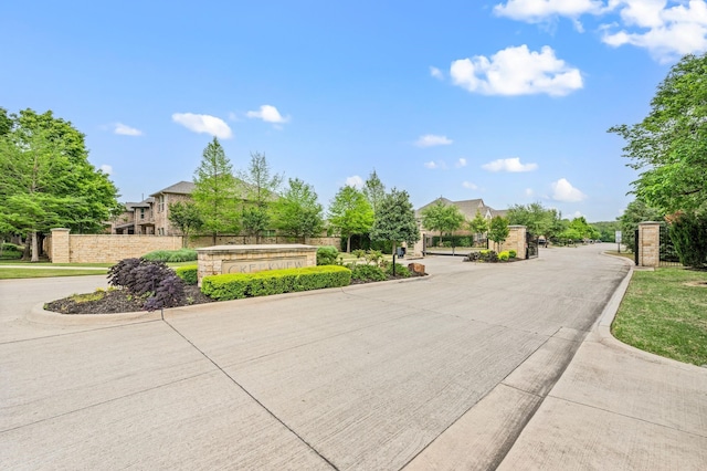 3037 Crestwater Rdg, Keller, TX 76248 - view of concrete road featuring a gated entry and curbs