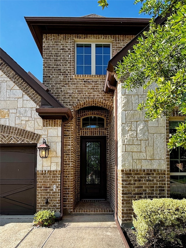 3037 Crestwater Rdg, Keller, TX 76248 - property entrance with brick siding, stone siding, and a garage
