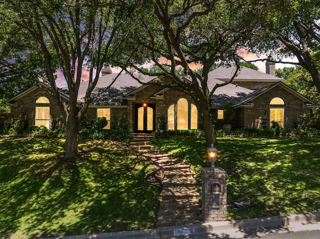 3740 Chimney Ridge Dr, Waco, TX 76708 - view of front of property with a lawn, brick siding, and a chimney