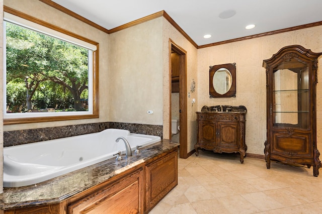 3740 Chimney Ridge Dr, Waco, TX 76708 - bathroom featuring crown molding, a jetted tub, vanity, and toilet