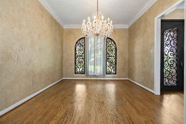 3740 Chimney Ridge Dr, Waco, TX 76708 - empty room featuring wood finished floors, a chandelier, ornamental molding, and baseboards