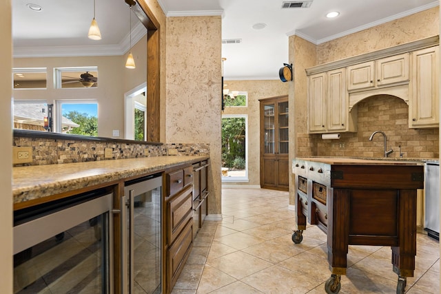 3740 Chimney Ridge Dr, Waco, TX 76708 - kitchen featuring wine cooler, a sink, tasteful backsplash, crown molding, and recessed lighting