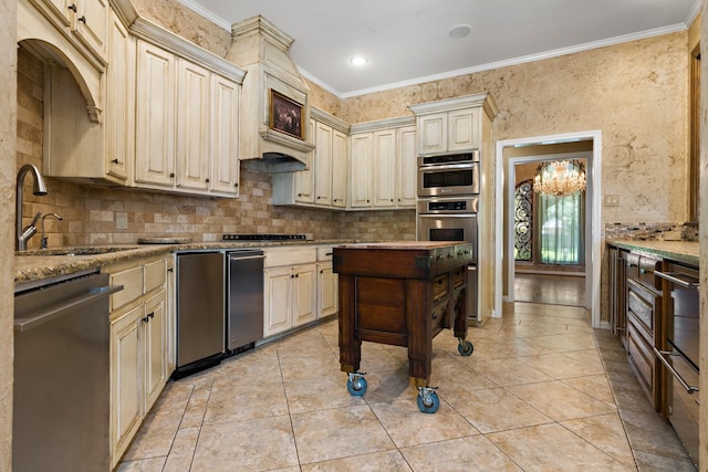 3740 Chimney Ridge Dr, Waco, TX 76708 - kitchen featuring cream cabinetry, dishwasher, a sink, tasteful backsplash, and crown molding
