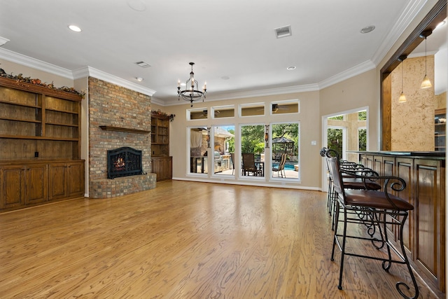 3740 Chimney Ridge Dr, Waco, TX 76708 - living area featuring a chandelier, ornamental molding, a fireplace, light wood finished floors, and recessed lighting