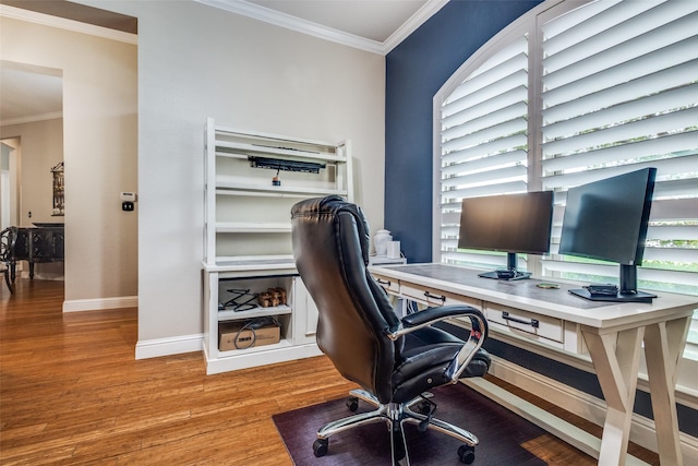 home office with wood finished floors, crown molding, and baseboards