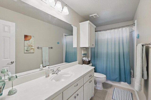 1601 Manchester Way, Corinth, TX 76210 - full bath with tile patterned flooring, vanity, toilet, and a shower with curtain