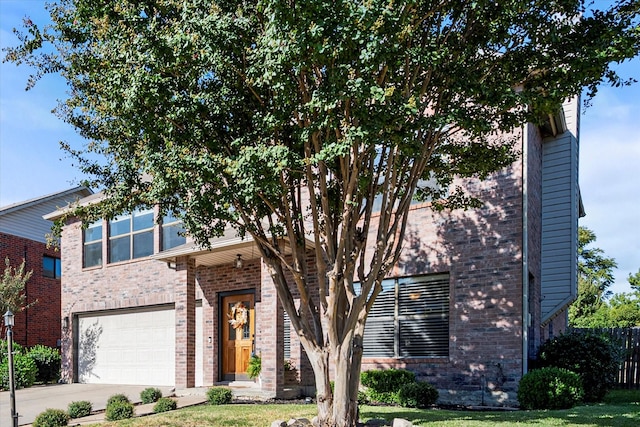 6612 Oldgate Ln, Arlington, TX 76002 - view of front of home featuring brick siding, concrete driveway, a garage, and fence