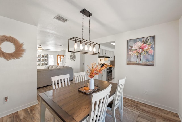 6612 Oldgate Ln, Arlington, TX 76002 - dining area with baseboards, wood finished floors, and a ceiling fan