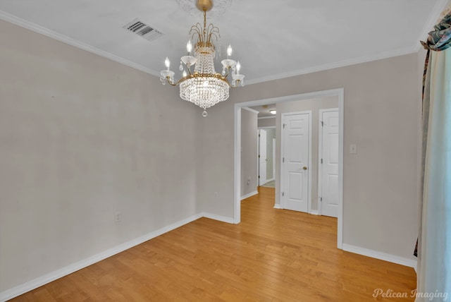 1403 Whispering Pines Dr, Minden, LA 71055 - empty room with a chandelier, baseboards, light wood-type flooring, and ornamental molding