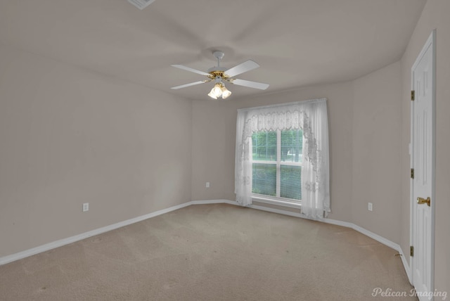 1403 Whispering Pines Dr, Minden, LA 71055 - unfurnished room featuring carpet flooring, baseboards, and a ceiling fan