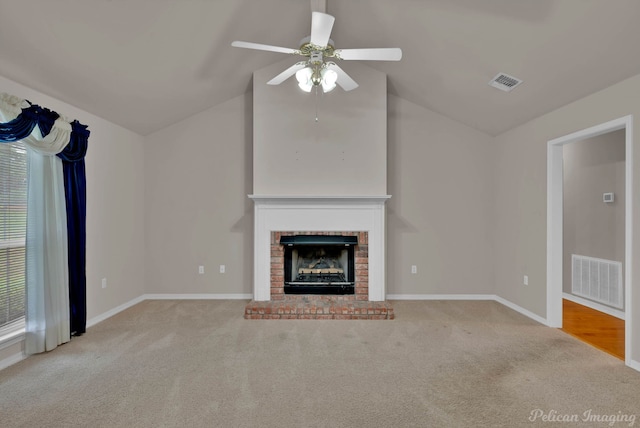 1403 Whispering Pines Dr, Minden, LA 71055 - unfurnished living room with carpet flooring, vaulted ceiling, a fireplace, ceiling fan, and baseboards
