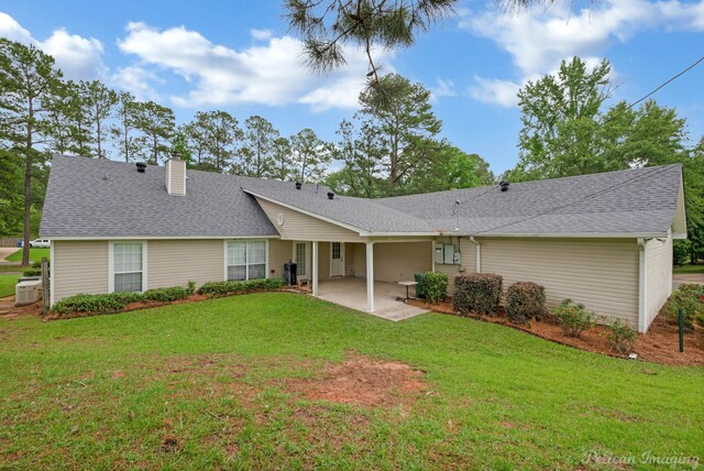 1403 Whispering Pines Dr, Minden, LA 71055 - back of house featuring a chimney, a patio, a yard, and roof with shingles