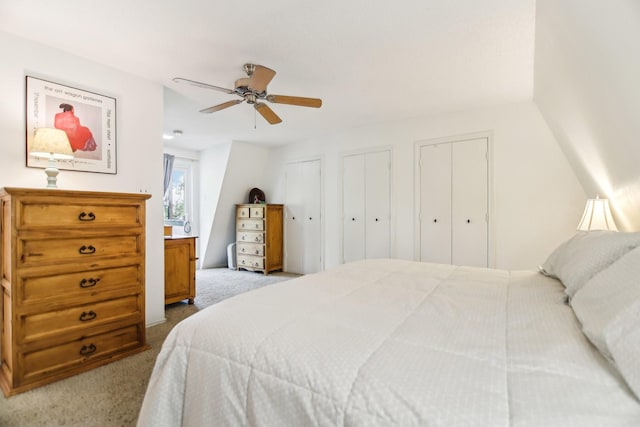 203 Goodson Way, Denton, TX 76207 - bedroom with carpet floors, two closets, and ceiling fan