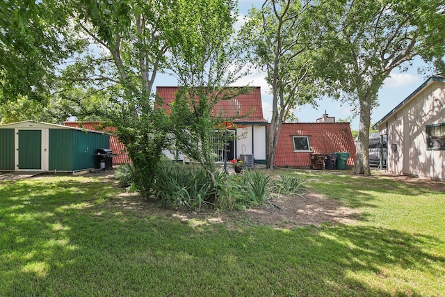 203 Goodson Way, Denton, TX 76207 - view of grassy yard featuring a shed and an outbuilding