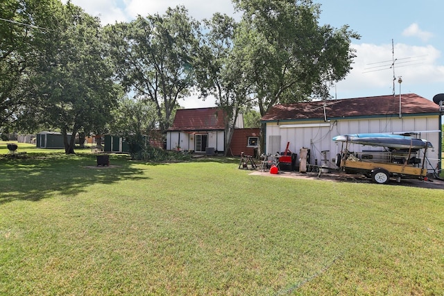 203 Goodson Way, Denton, TX 76207 - view of grassy yard with an outbuilding
