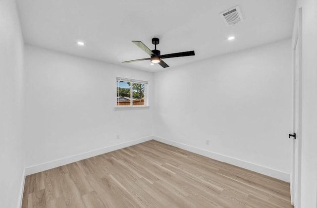 empty room with ceiling fan, light wood-style floors, baseboards, and recessed lighting