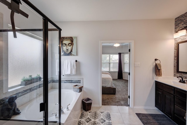 10804 Abbeyglen Ct, Fort Worth, TX 76052 - ensuite bathroom with tile patterned flooring, vanity, a bath, baseboards, and a shower stall