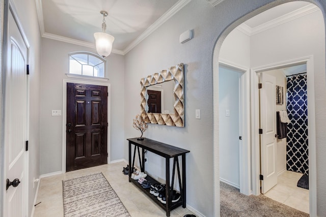 10804 Abbeyglen Ct, Fort Worth, TX 76052 - entryway featuring arched walkways, ornamental molding, and light tile patterned flooring