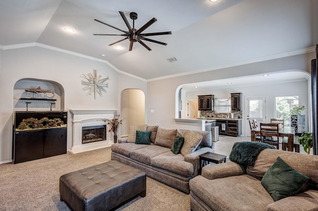 10804 Abbeyglen Ct, Fort Worth, TX 76052 - living room with arched walkways, vaulted ceiling, ceiling fan, crown molding, and a fireplace with raised hearth
