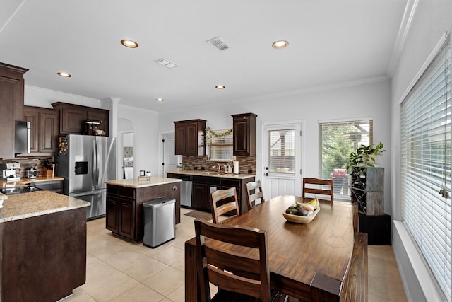 10804 Abbeyglen Ct, Fort Worth, TX 76052 - dining space with light tile patterned floors, recessed lighting, and ornamental molding