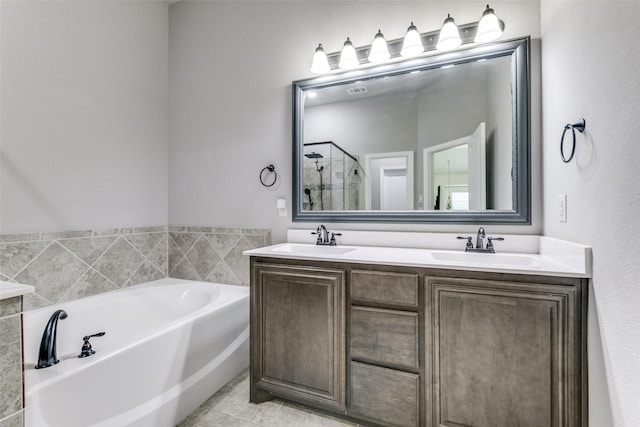 936 Mangrove Dr, Fate, TX 75087 - bathroom with a bath, a stall shower, double vanity, and tile patterned flooring