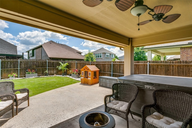 936 Mangrove Dr, Fate, TX 75087 - view of patio / terrace featuring a covered hot tub, ceiling fan, and a fire pit