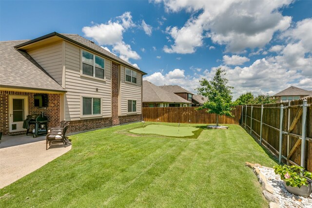 936 Mangrove Dr, Fate, TX 75087 - view of yard featuring a putting area and a patio