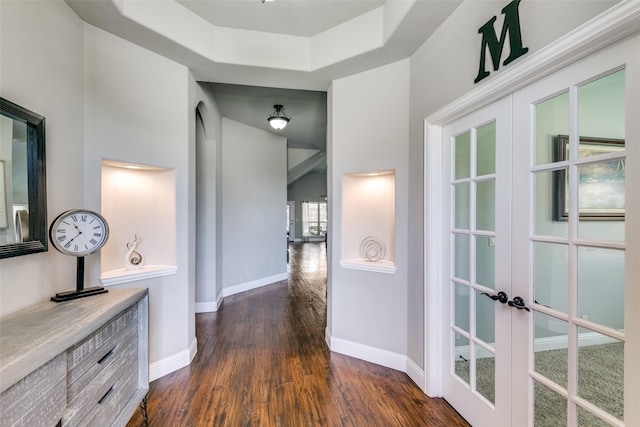 936 Mangrove Dr, Fate, TX 75087 - hall with french doors, dark wood finished floors, and baseboards