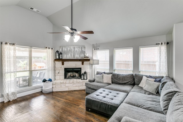 936 Mangrove Dr, Fate, TX 75087 - living room featuring vaulted ceiling, a ceiling fan, a stone fireplace, and dark wood-style flooring