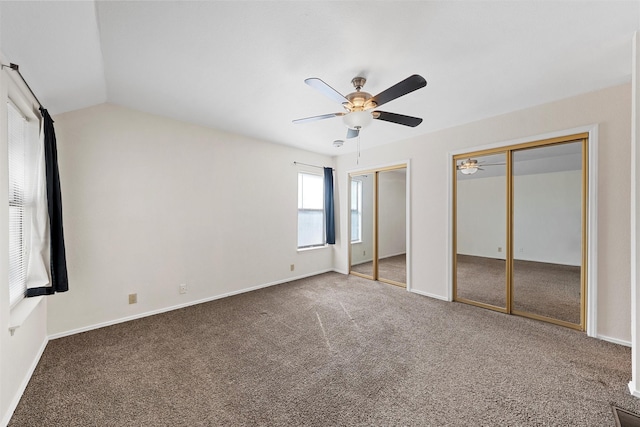 1300 Chapel Downs Rd, Waco, TX 76712 - unfurnished bedroom featuring carpet, multiple closets, baseboards, a ceiling fan, and lofted ceiling