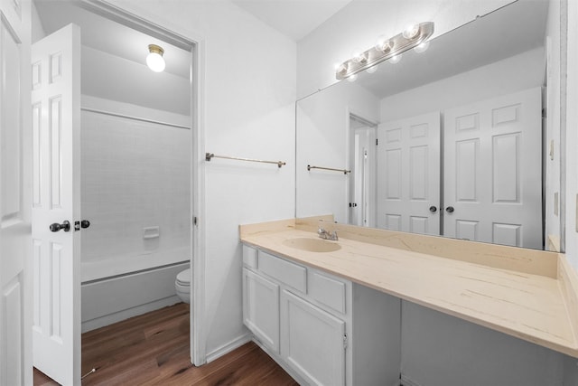 1300 Chapel Downs Rd, Waco, TX 76712 - bathroom with wood finished floors, toilet, vanity, and washtub / shower combination