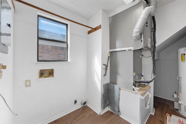 1300 Chapel Downs Rd, Waco, TX 76712 - utility room with heating unit and water heater