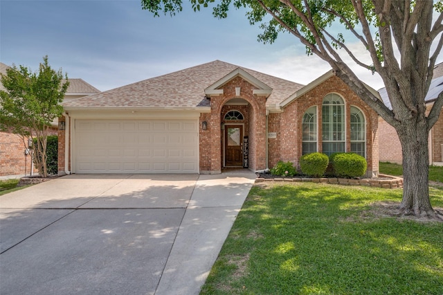8209 Clear Bay Dr, Mckinney, TX 75072 - view of front of property with driveway, brick siding, a garage, a front lawn, and a shingled roof