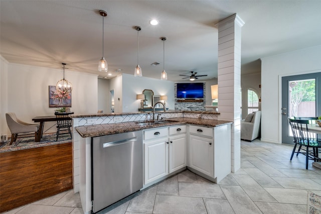 8209 Clear Bay Dr, Mckinney, TX 75072 - kitchen featuring stainless steel dishwasher, a sink, open floor plan, ceiling fan, and dark stone counters