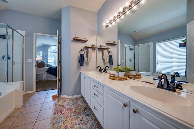 8209 Clear Bay Dr, Mckinney, TX 75072 - ensuite bathroom with lofted ceiling, a stall shower, tile patterned flooring, double vanity, and baseboards