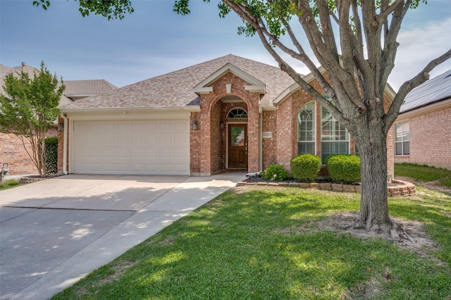 8209 Clear Bay Dr, Mckinney, TX 75072 - view of front of property with brick siding, roof with shingles, concrete driveway, and a garage