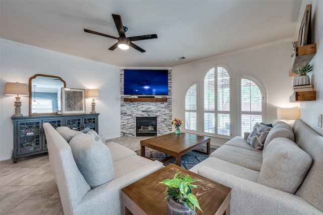 8209 Clear Bay Dr, Mckinney, TX 75072 - living area featuring ceiling fan, ornamental molding, a fireplace, and baseboards