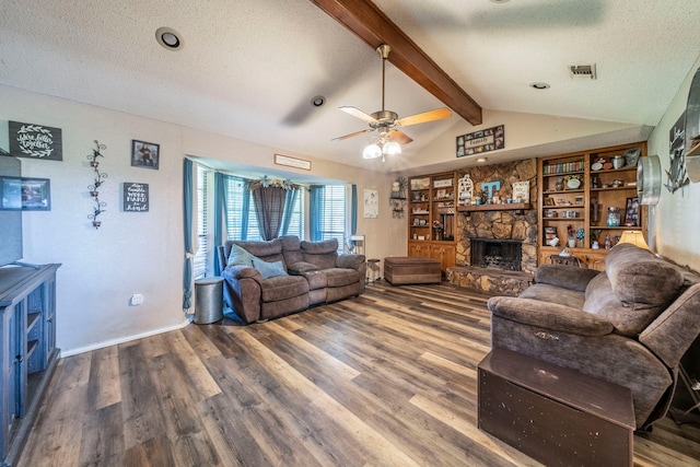 916 Rachelle Dr, Red Oak, TX 75154 - living area with a fireplace, wood finished floors, a textured ceiling, and ceiling fan