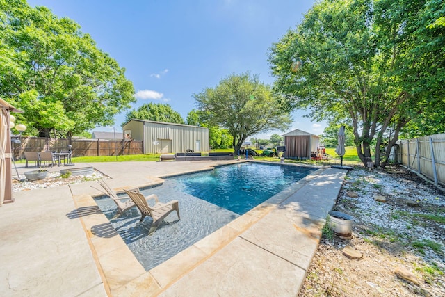 916 Rachelle Dr, Red Oak, TX 75154 - view of pool with a patio, a shed, an outbuilding, and a fenced backyard