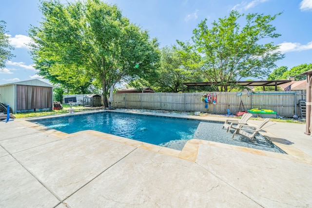 916 Rachelle Dr, Red Oak, TX 75154 - view of pool with a patio, a fenced backyard, a storage shed, and an outdoor structure