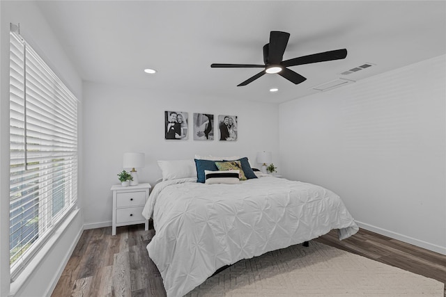 bedroom with wood finished floors, recessed lighting, baseboards, and ceiling fan