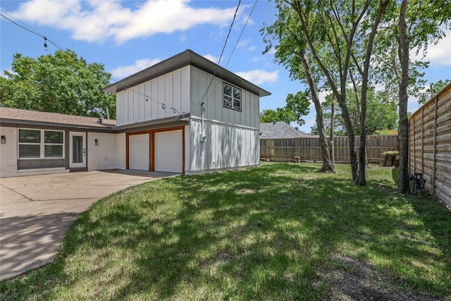 view of side of property with board and batten siding, concrete driveway, brick siding, and an attached garage