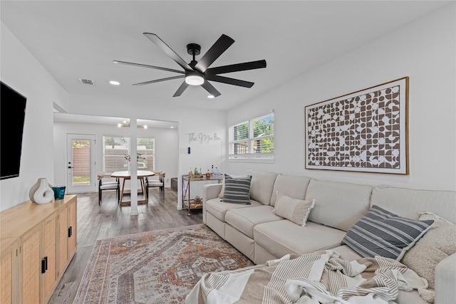 living room with ceiling fan, light wood finished floors, and recessed lighting