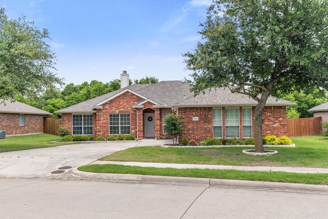 2040 Gleaner Dr, Rockwall, TX 75032 - view of front of house featuring brick siding, a chimney, and a shingled roof
