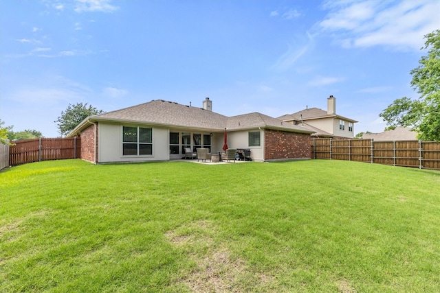 2040 Gleaner Dr, Rockwall, TX 75032 - back of house with a patio area, brick siding, and a chimney
