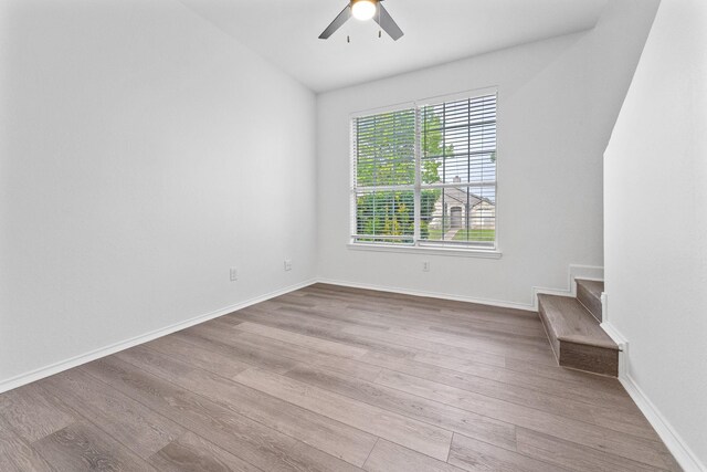 7919 Maiden Ln, Frisco, TX 75035 - spare room with ceiling fan, wood finished floors, stairway, and baseboards